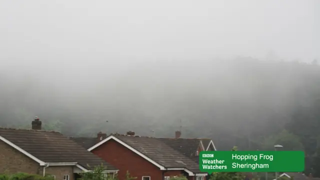 Low cloud over house roofs