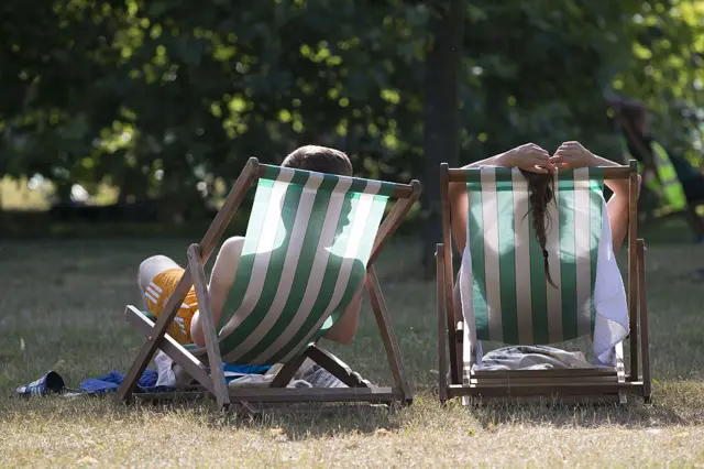 sunbathers in park