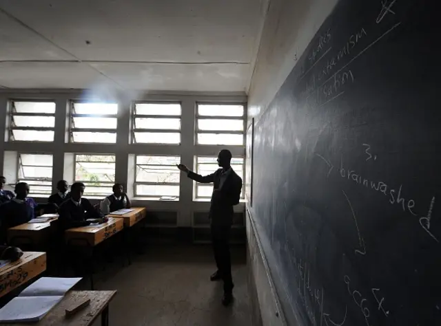 A picture taken on March 3, 2016 shows Kenyan teacher Ayub Mohamed giving a lesson in the Nairobi suburb of Eastleigh