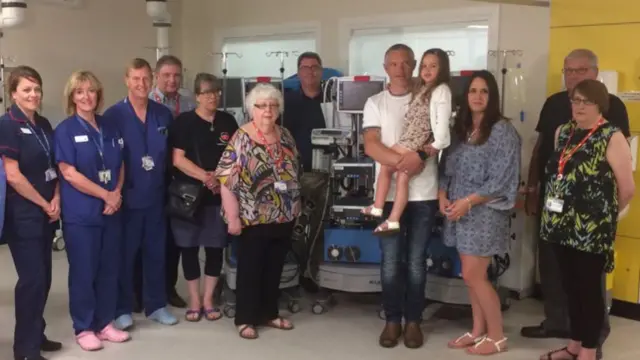 Page family with ECMO machine and staff at Glenfield Hospital