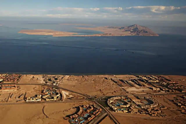 File photo taken on 14 January through the window of an airplane shows the islands of Tiran (foreground) and Sanafir (background) in the Red Sea