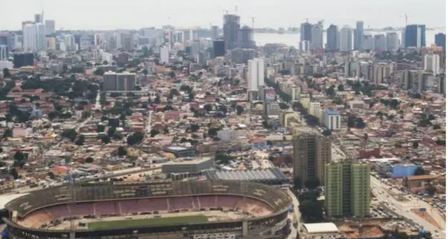 The skyline of central Luanda, Angola, with the 'Estadio da Cidadela' stadium in foreground