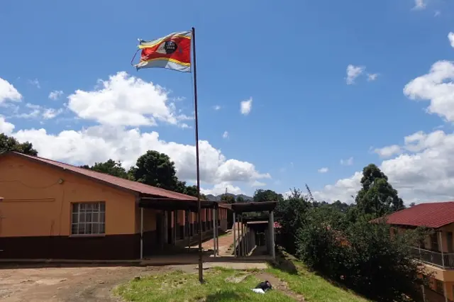 Kingdom of Swaziland flag flies on a mast by a public school on January 22, 2017 in Mbabane, Swaziland. Swaziland's schools opened for the new academic year on January 24, 2017