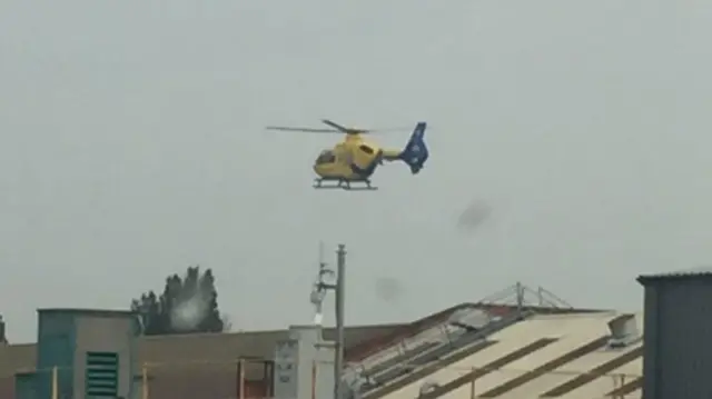 Police helicopter over crane in Crewe