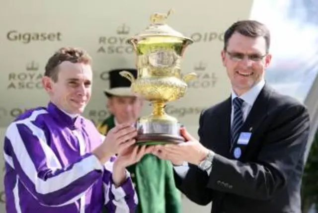 Jockey Ryan Moore with trainer Aidan O'Brien after Highland Reel won the Prince of Wales's Stakes