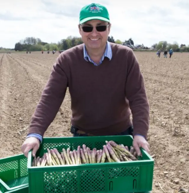 Andy Allen with a crate of asparagus