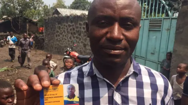 Man holding an id card