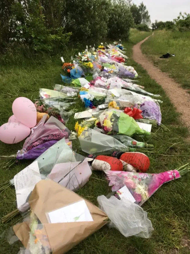 Tributes laid for Spencer Hurst by the lake where he drowned