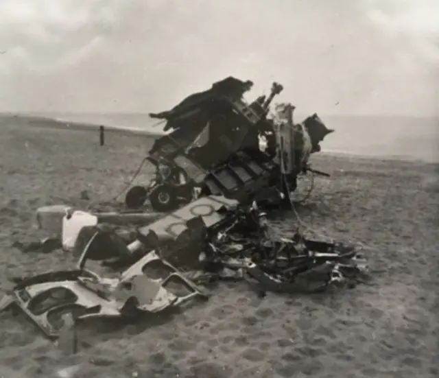 Black and white photo showing aircraft wreckage