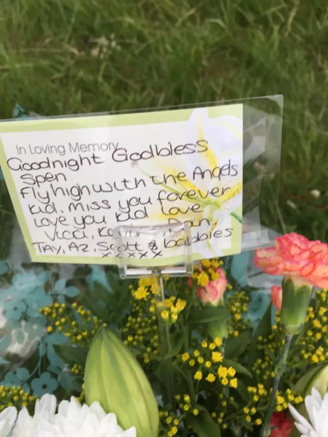 A note left by mourners reading "Goodnight God bless Spen.  Fly high with the Angels Kid, miss you forever."