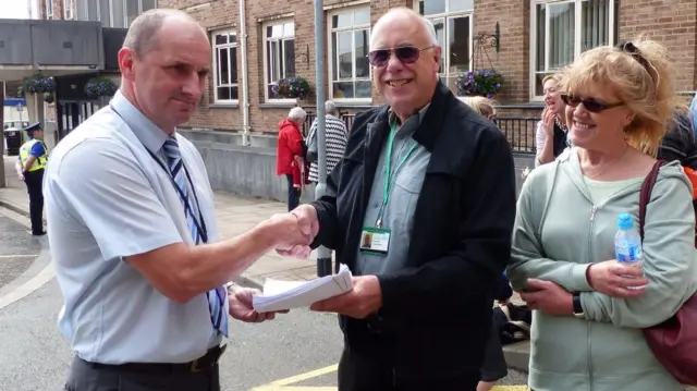 The petition being handed to the council