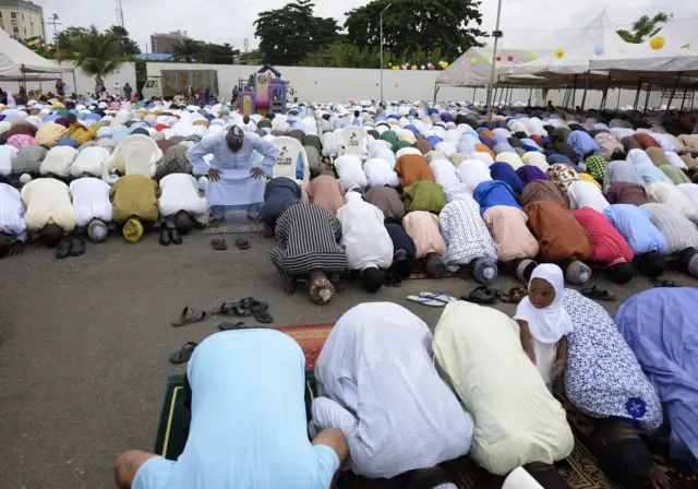 Muslim worshippers pray at the Syrian Mosque in Lagos during the celebration of Eid al-Fitr, marking the end of the fasting month of Ramadan, on July 6, 2016