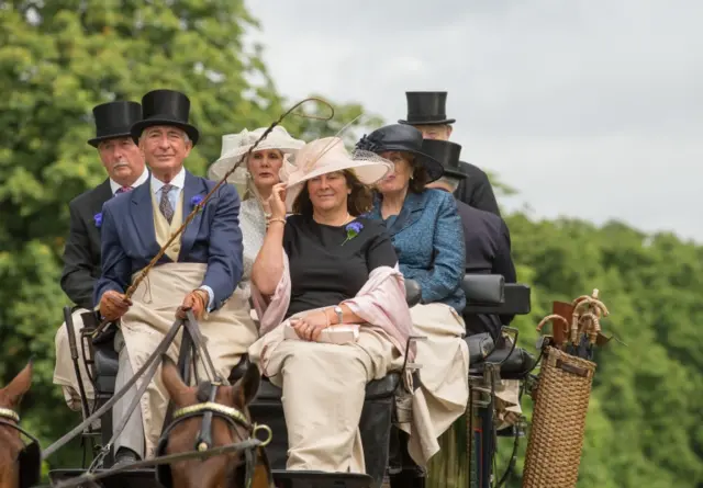 Racegoers on carriage