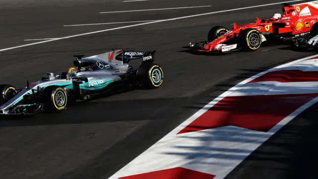 Lewis Hamilton pursued by Sebastian Vettel