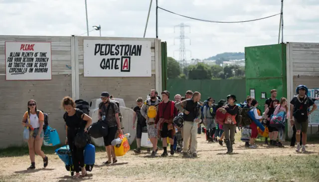 Glastonbury Festival-goers leave Worthy Farm