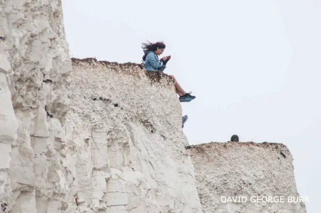 People on cliffs at Birling Gap