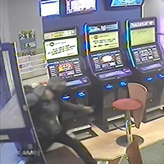 knifeman holds up bookmakers