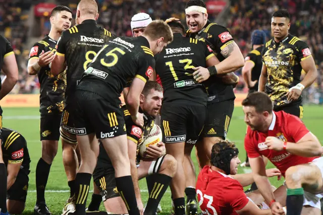 Callum Gibbins scores a try