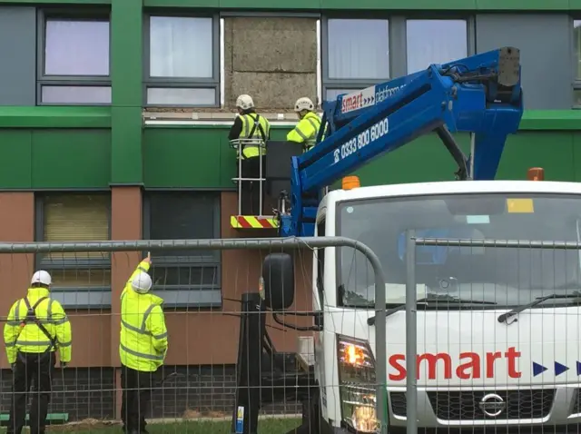 Work to remove cladding continues