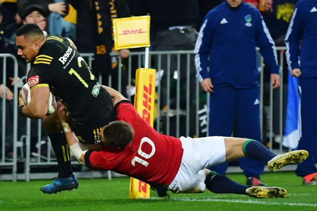 Ngani Laumape is tackled before scoring a try