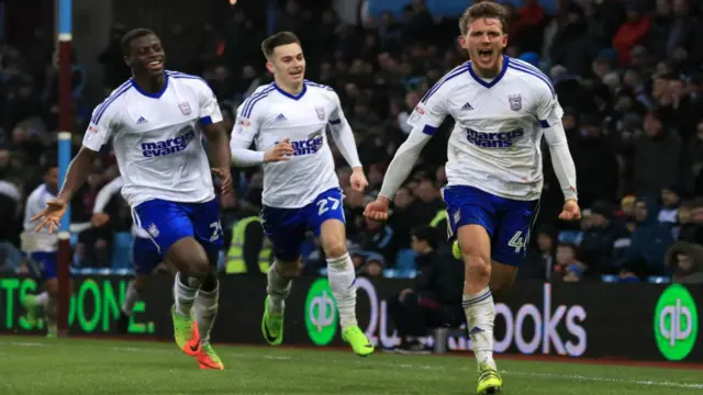 Josh Emmanuel, Tom Lawrence and Emyr Huws celebrate a Huws goal