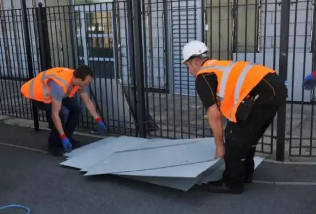 Cladding being removed