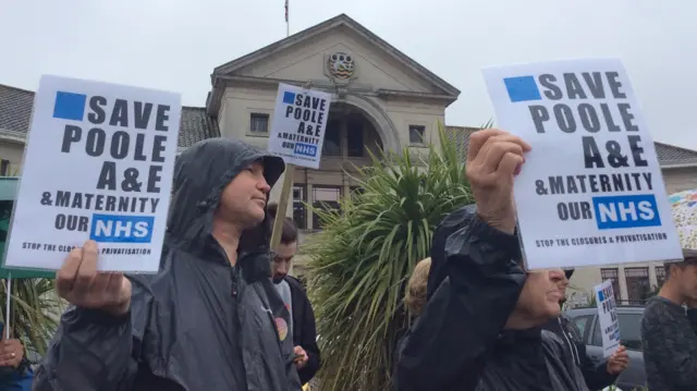 Activists protest outside Poole council offices