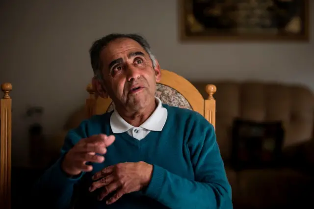 Former anti-apartheid activist Mohamed Timol, brother of the late Ahmed Timol poses at his home in Johannesburg on June 12, 2017