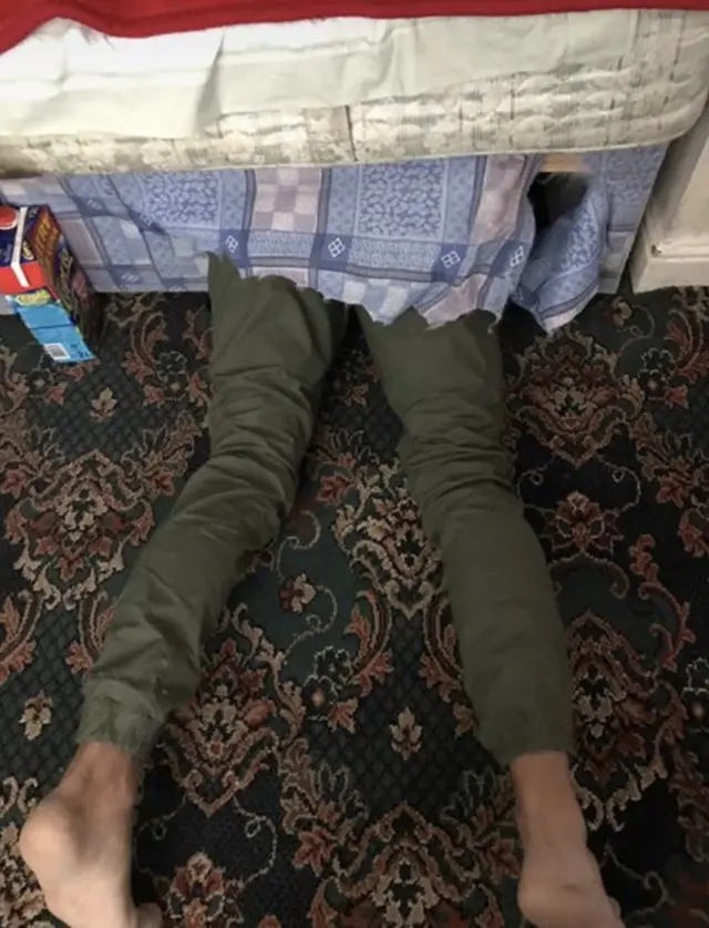 Man under bed