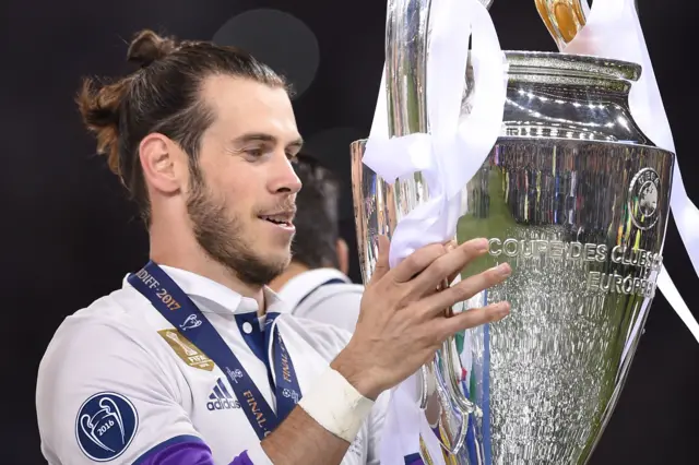 Gareth Bale holds the trophy