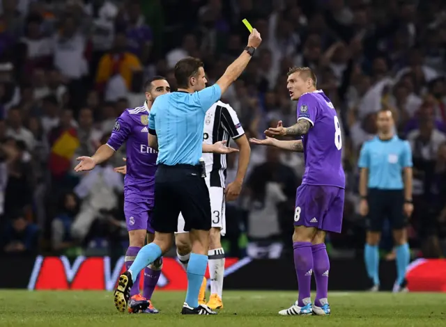 Toni Kroos is shown a yellow card