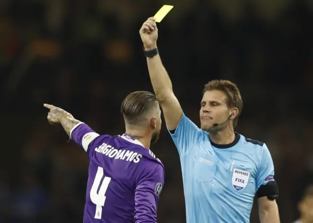 Sergio Ramos is shown a yellow card