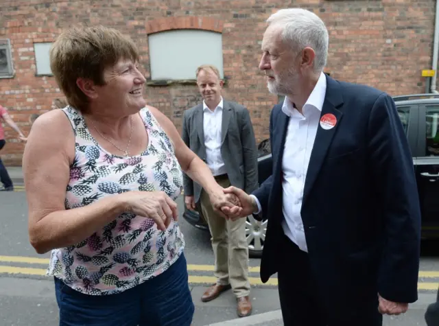 Jeremy Corbyn with voter