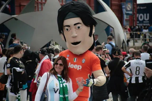 Buffon the mascot with a fan