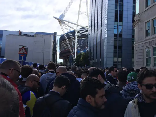 Fans line up to get into the stadium