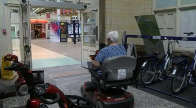 Woman on a mobility scooter
