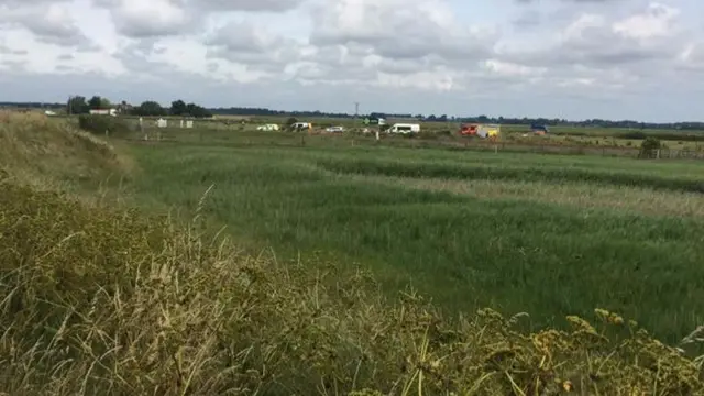 Emergency services' vehicles parked near Breydon Water