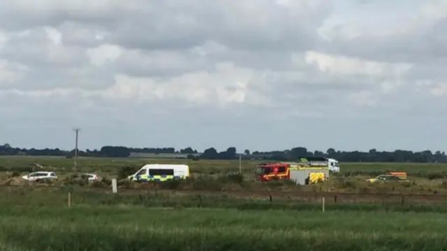 Emergency services' vehicles parked near Breydon Water