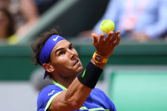 Rafael Nadal serves