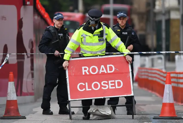 Police guarding a closed road near Borough Market