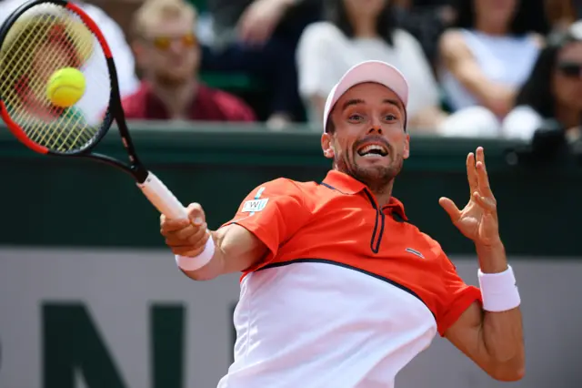 Roberto Bautista Agut returns the ball