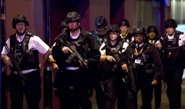 Armed police patrol the London Bridge area