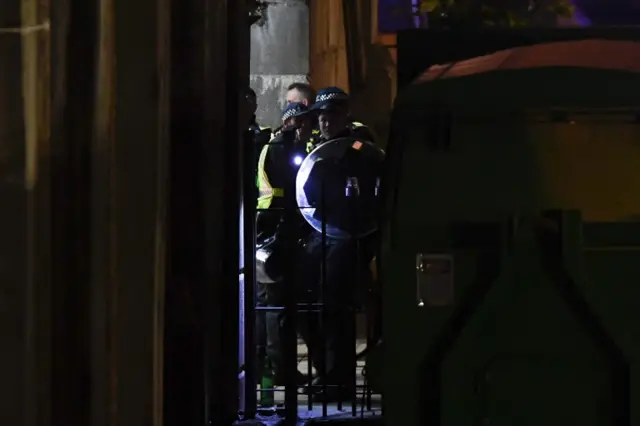 Police take part in a search near the scene of a terror attack on London Bridge