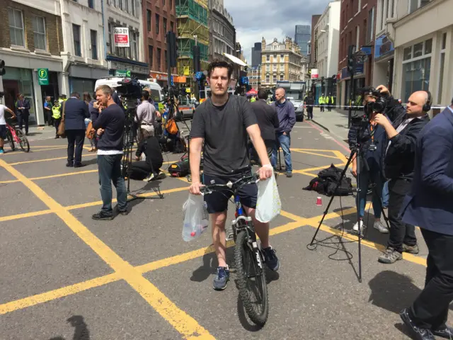 Paul on his bike with water