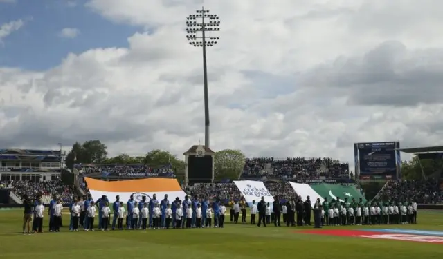 Cricket teams during silence