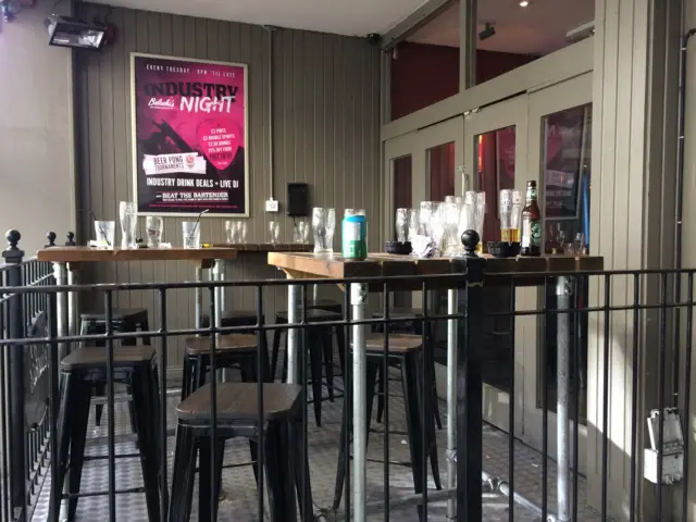 Empty glasses outside a bar