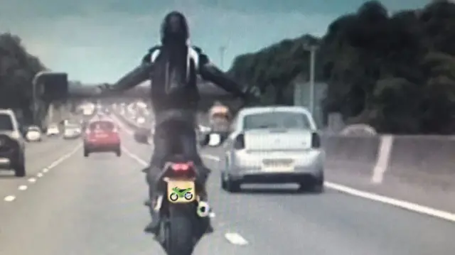 Biker caught on camera in Staffordshire on M6 standing up on bike