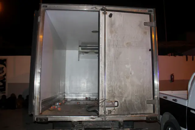 A refrigerated truck, in which some migrants were found dead, is seen in the coastal city of Tripoli, Libya, June 4, 2017.