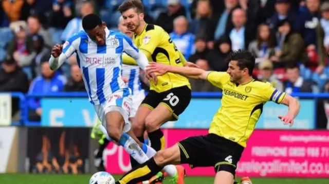 John Mousinho (right) joined Burton from Preston in 2014