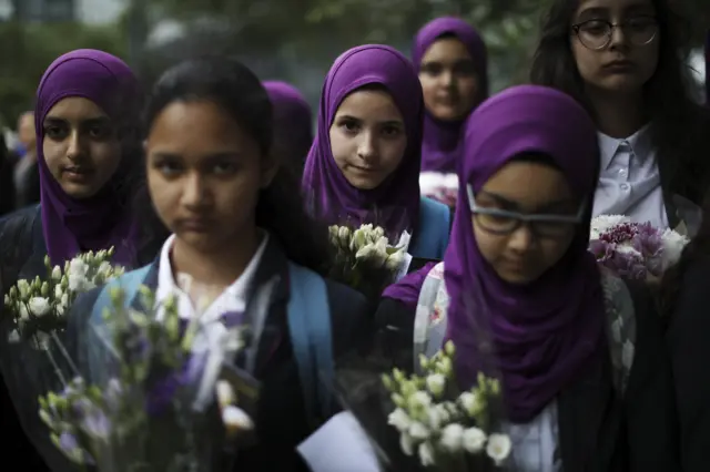 Pupils from Eden Girls" School in Waltham Forest take part in a vigil in memory of those killed in the recent terror attacks in London, in Potters Fields Park on June 5, 2017